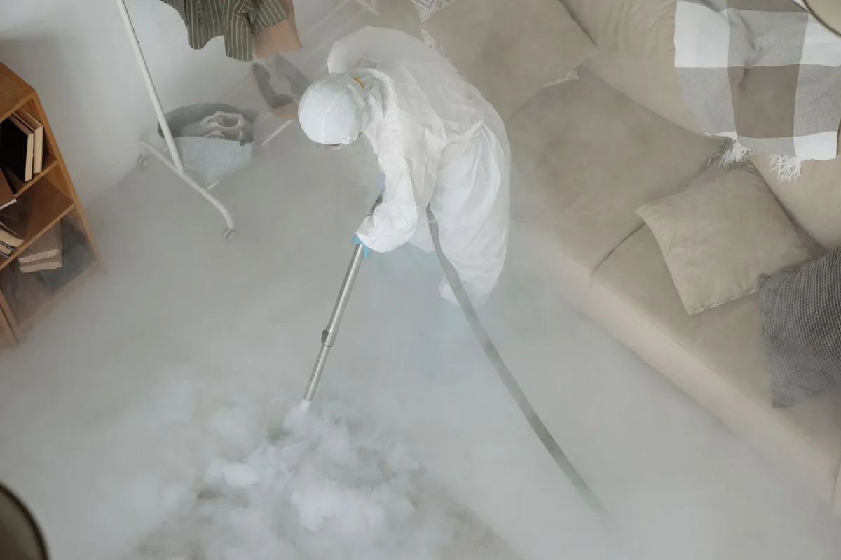Biohazard cleanup technician in protective equipment, Terryville, CT